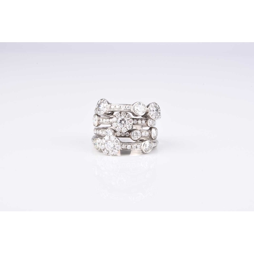 227 - A Boodles style diamond ring, designed as four graduated brilliant cut diamond set bands set with si... 