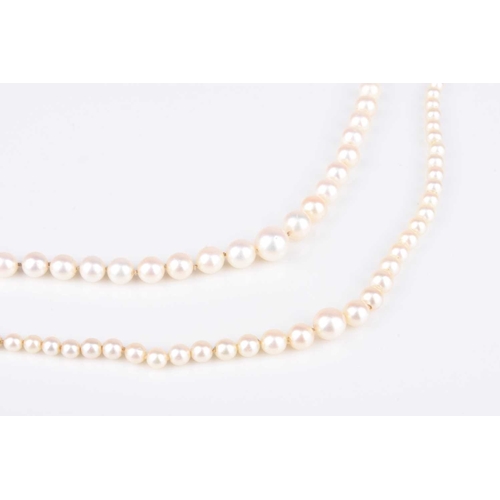 228 - A single strand graduated cultured pearl necklace, with diamond set white metal clasp, stamped '9ct'... 