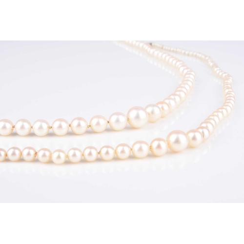 228 - A single strand graduated cultured pearl necklace, with diamond set white metal clasp, stamped '9ct'... 