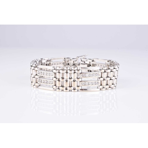 237 - A diamond set gate link bracelet, designed as alternating diamond and brick links with integral push... 