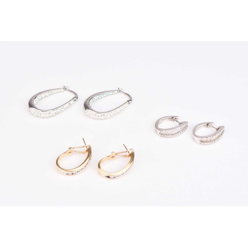 252 - A pair of yellow metal diamond set hoop earrings, stamped '14k', together with a pair of white metal... 