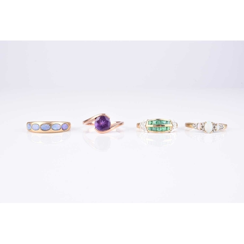 259 - A collection of four 9ct gold stone set rings, comprising; an emerald and diamond example, size S, t... 