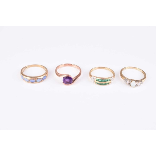 259 - A collection of four 9ct gold stone set rings, comprising; an emerald and diamond example, size S, t... 