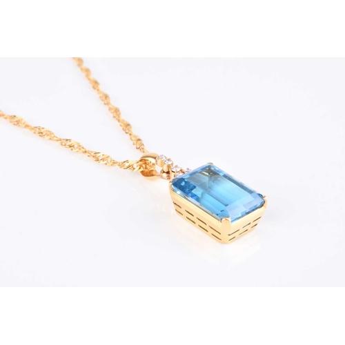 261 - A blue topaz and diamond pendant on chain, the pendant designed as a large rectangular faceted blue ... 