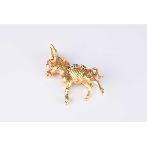 263 - An 18ct yellow gold gem set novelty donkey brooch, the donkey's saddle set with diamonds, sapphires,... 