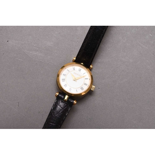 277 - Gucci: A gentleman's gold plated bracelet watch Ref. 7300, 1996, quartz movement, white dial with Ro... 