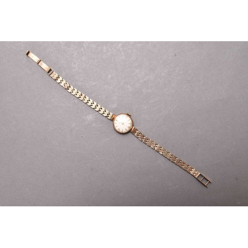 290 - Tissot: A lady's 9ct gold bracelet watch Date: Circa 1961 Movement: 17 jewel manual wind Dial: Silve... 