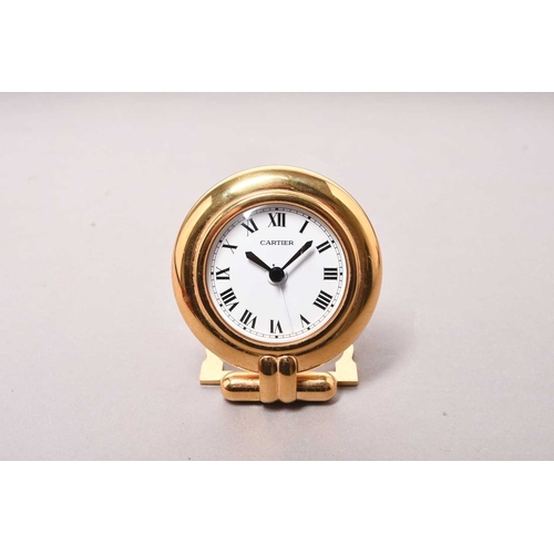 312 - Cartier: A gilt brass desk alarm clock Date: Circa 2000 Movement: Quartz Dial: White, black Roman nu... 