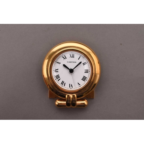 312 - Cartier: A gilt brass desk alarm clock Date: Circa 2000 Movement: Quartz Dial: White, black Roman nu... 