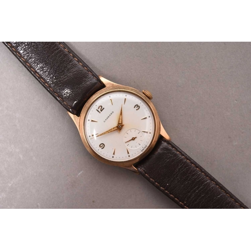 328 - Garrard: A gentleman's 9ct gold wristwatch Date: 1961 Movement: 17 jewel manual wind Dial: Silver, a... 