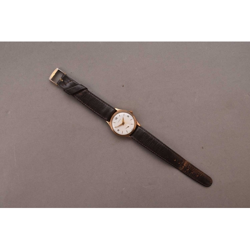 328 - Garrard: A gentleman's 9ct gold wristwatch Date: 1961 Movement: 17 jewel manual wind Dial: Silver, a... 