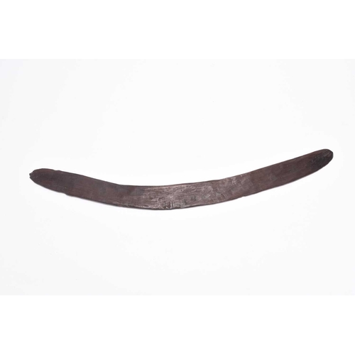 330 - A hand-carved wooden boomerang, believed to be Australian (Aboriginal) 19th century, of typical form... 