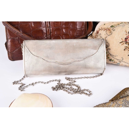 362 - A group of vintage handbags and purses Including two tan crocodile pattern leather clutch bags, an E... 