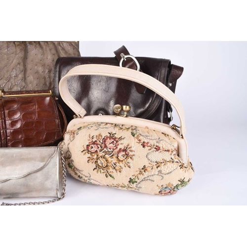 362 - A group of vintage handbags and purses Including two tan crocodile pattern leather clutch bags, an E... 