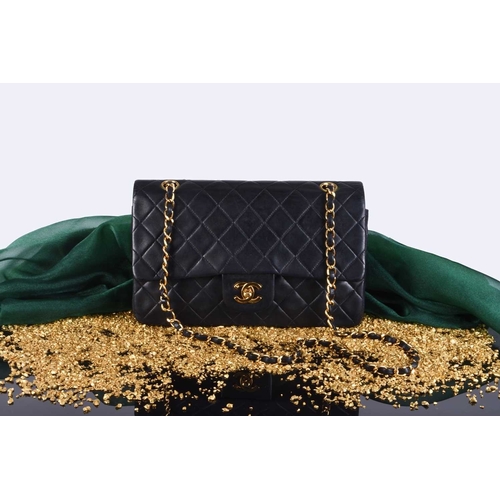 363 - Chanel: A medium double flap Classic bag Black quilted lambskin with gold toned hardware, leather an... 