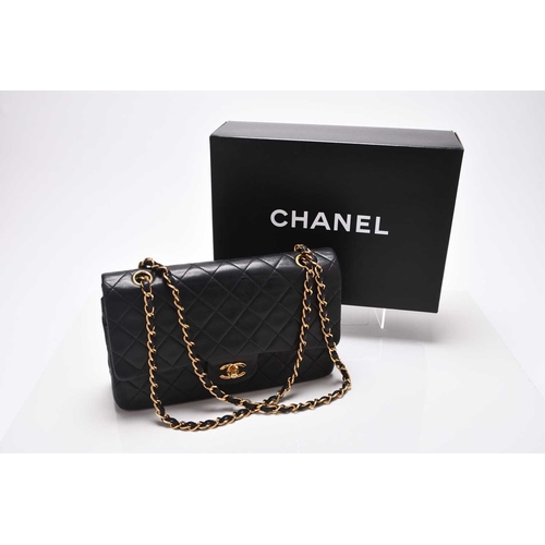 363 - Chanel: A medium double flap Classic bag Black quilted lambskin with gold toned hardware, leather an... 