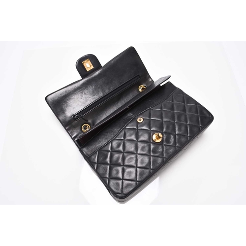 363 - Chanel: A medium double flap Classic bag Black quilted lambskin with gold toned hardware, leather an... 