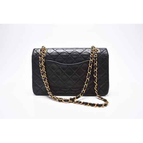 363 - Chanel: A medium double flap Classic bag Black quilted lambskin with gold toned hardware, leather an... 