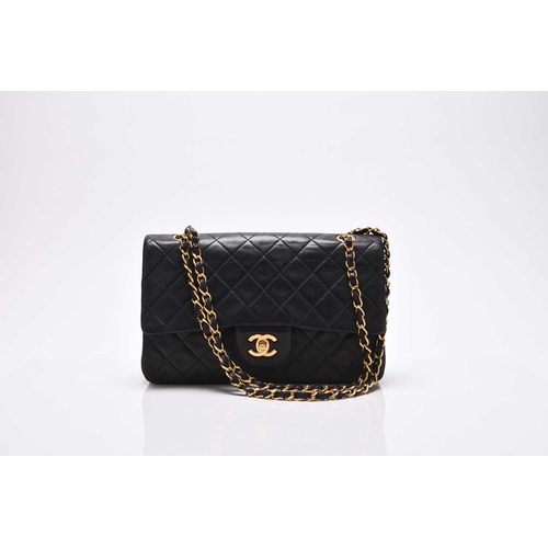 363 - Chanel: A medium double flap Classic bag Black quilted lambskin with gold toned hardware, leather an... 