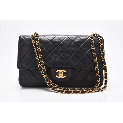 363 - Chanel: A medium double flap Classic bag Black quilted lambskin with gold toned hardware, leather an... 