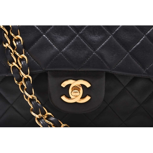 363 - Chanel: A medium double flap Classic bag Black quilted lambskin with gold toned hardware, leather an... 