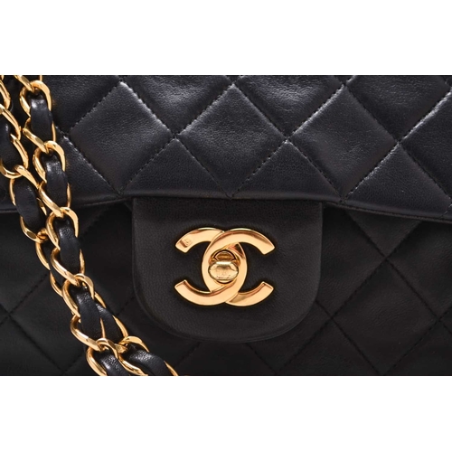 363 - Chanel: A medium double flap Classic bag Black quilted lambskin with gold toned hardware, leather an... 