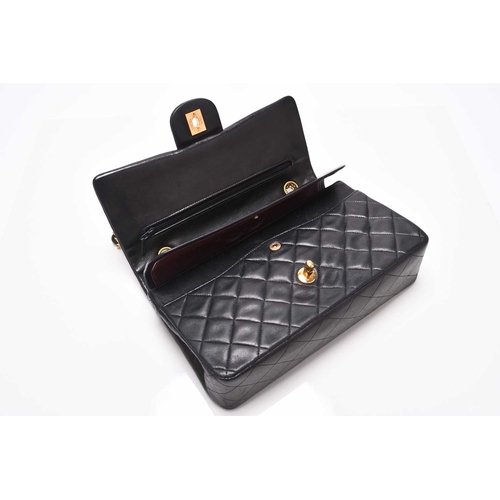 363 - Chanel: A medium double flap Classic bag Black quilted lambskin with gold toned hardware, leather an... 