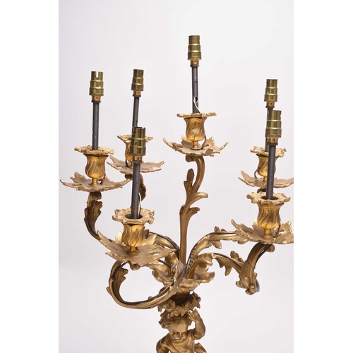 385 - A pair of ormolu rococo revival figural candelabra table lights 19th/20th century, the six branches ... 