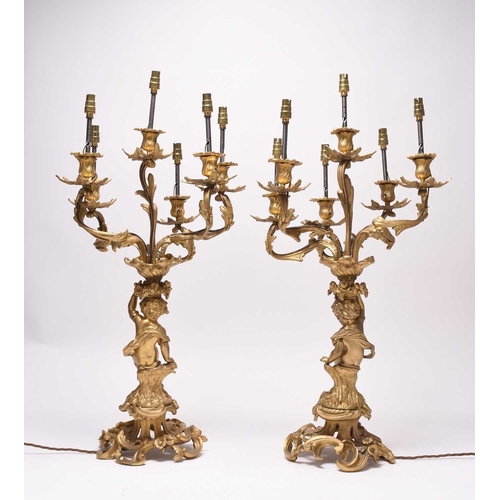 385 - A pair of ormolu rococo revival figural candelabra table lights 19th/20th century, the six branches ... 