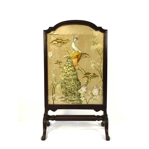 400 - A Victorian mahogany and embroidered firescreen The shaped moulded screen frame enclosing a wool emb... 