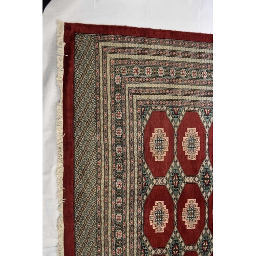 406 - A fine hand woven Jaldar carpet, Pakistan The centre with multiple red guls within multiple borders ... 