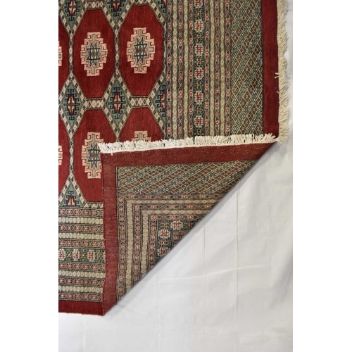 406 - A fine hand woven Jaldar carpet, Pakistan The centre with multiple red guls within multiple borders ... 