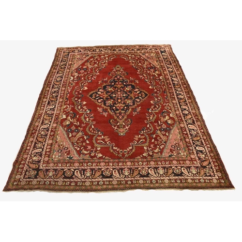 407 - A Hamadan village carpet, Iran With a central dark blue medallion on a red ground, within pink spand... 