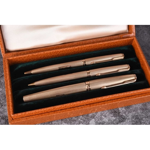 41 - A cased three piece 9ct gold Parker pen set, comprising; a fountain pen, ball point pen and propelli... 