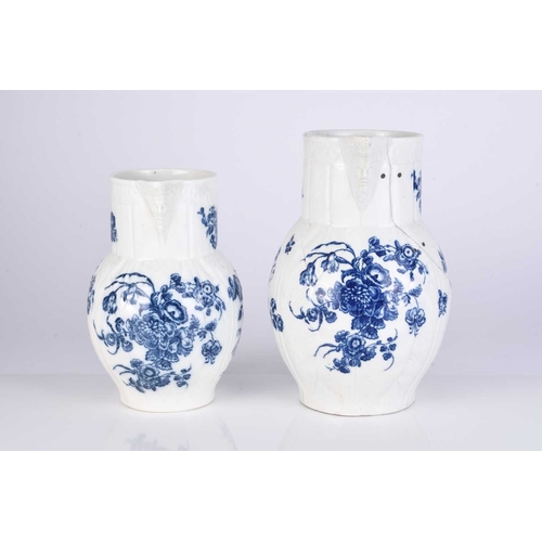 434 - Two Caughley porcelain 'Bouquets' cabbage leaf maskhead jugs, circa 1785, transfer-printed in underg... 