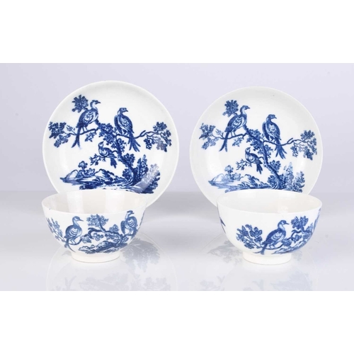 438 - Two Caughley porcelain 'Birds in Branches' tea bowls and saucers, one circa 1778-80, the other 1785-... 