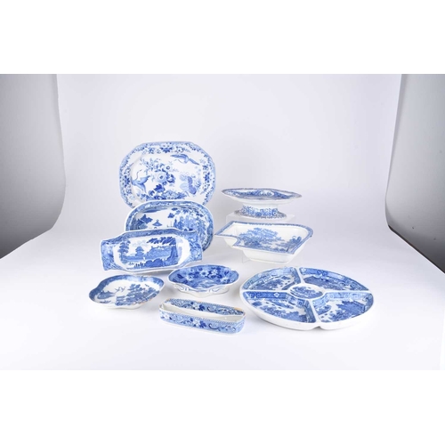 478 - A collection of English blue and white earthenware, early 19th century, comprising a compartmentaliz... 