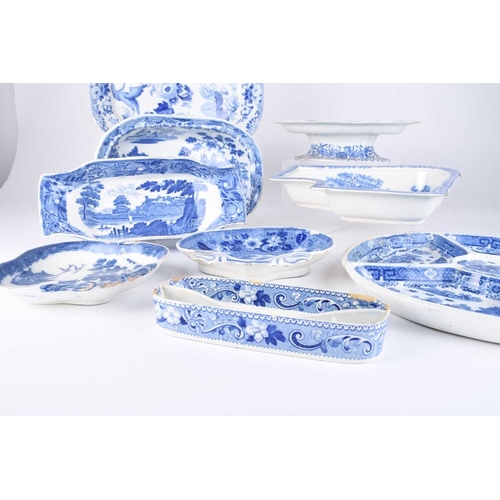 478 - A collection of English blue and white earthenware, early 19th century, comprising a compartmentaliz... 