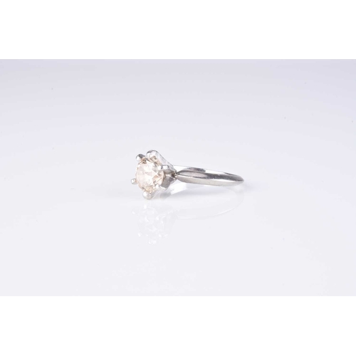 48 - A single stone diamond ring, the brilliant cut diamond claw set in white metal, stamped 'PT 950', ri... 