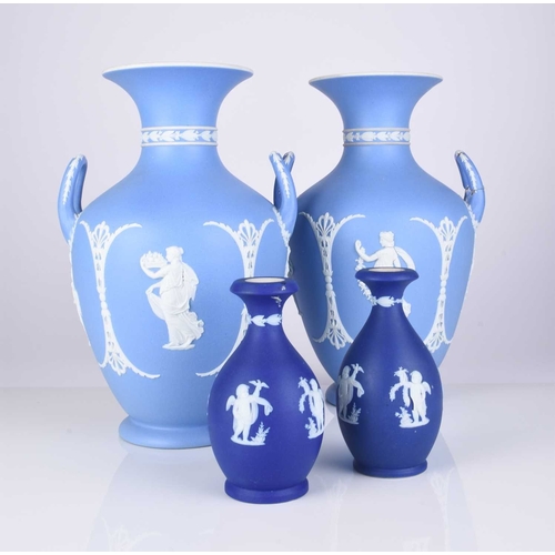 505 - A pair of Wedgwood light blue jasperware dip vases, late 19th/early 20th century, modelled in relief... 