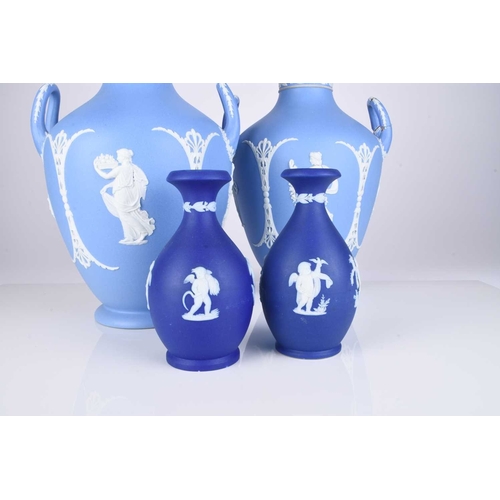 505 - A pair of Wedgwood light blue jasperware dip vases, late 19th/early 20th century, modelled in relief... 