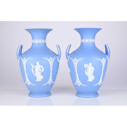 505 - A pair of Wedgwood light blue jasperware dip vases, late 19th/early 20th century, modelled in relief... 