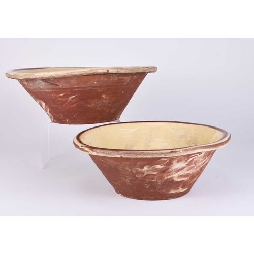 506 - Two large slipware terracotta dairy bowls, 19th century, 31cm and 36.5cm diameter (one cracked)