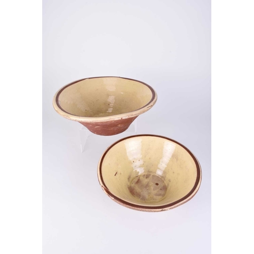 506 - Two large slipware terracotta dairy bowls, 19th century, 31cm and 36.5cm diameter (one cracked)