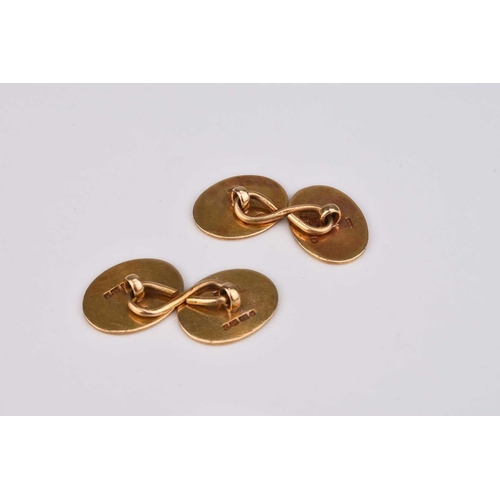 51 - A pair of Victorian 18ct gold cufflinks, each engraved with crest, hallmarked London 1876, total wei... 