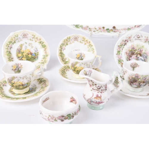 530 - A Royal Doulton Brambly Hedge miniature seasons tea service, comprising a tray, four teacups, four s... 