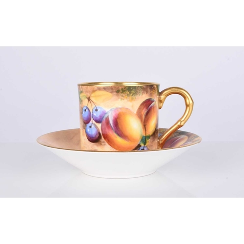 557 - A Royal Worcester fruit-decorated coffee can and saucer by William Roberts, post-war, artist signed,... 