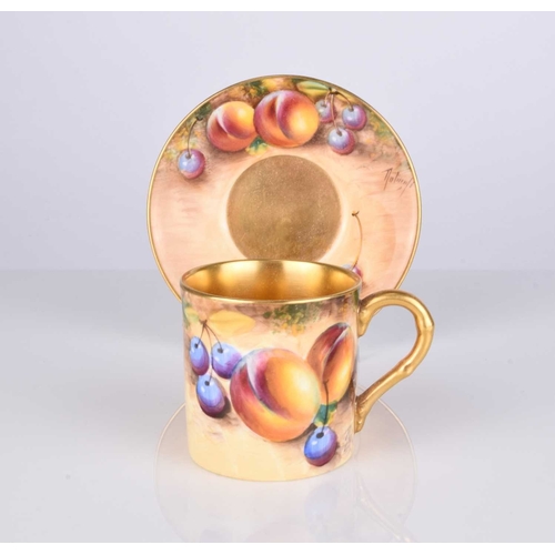 557 - A Royal Worcester fruit-decorated coffee can and saucer by William Roberts, post-war, artist signed,... 