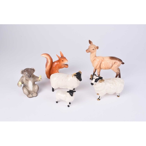 566 - A small group of Beswick and John Beswick animals, comprising a family of black-faced sheep (ram, ew... 