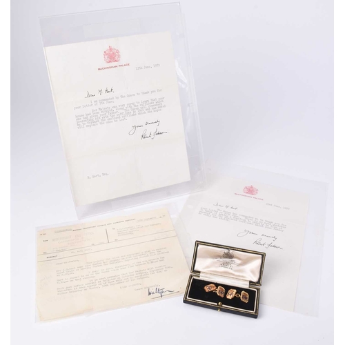 59 - A pair of Elizabeth II 9ct gold and enamel cufflinks, each cufflink with the Royal monogram E II R a... 